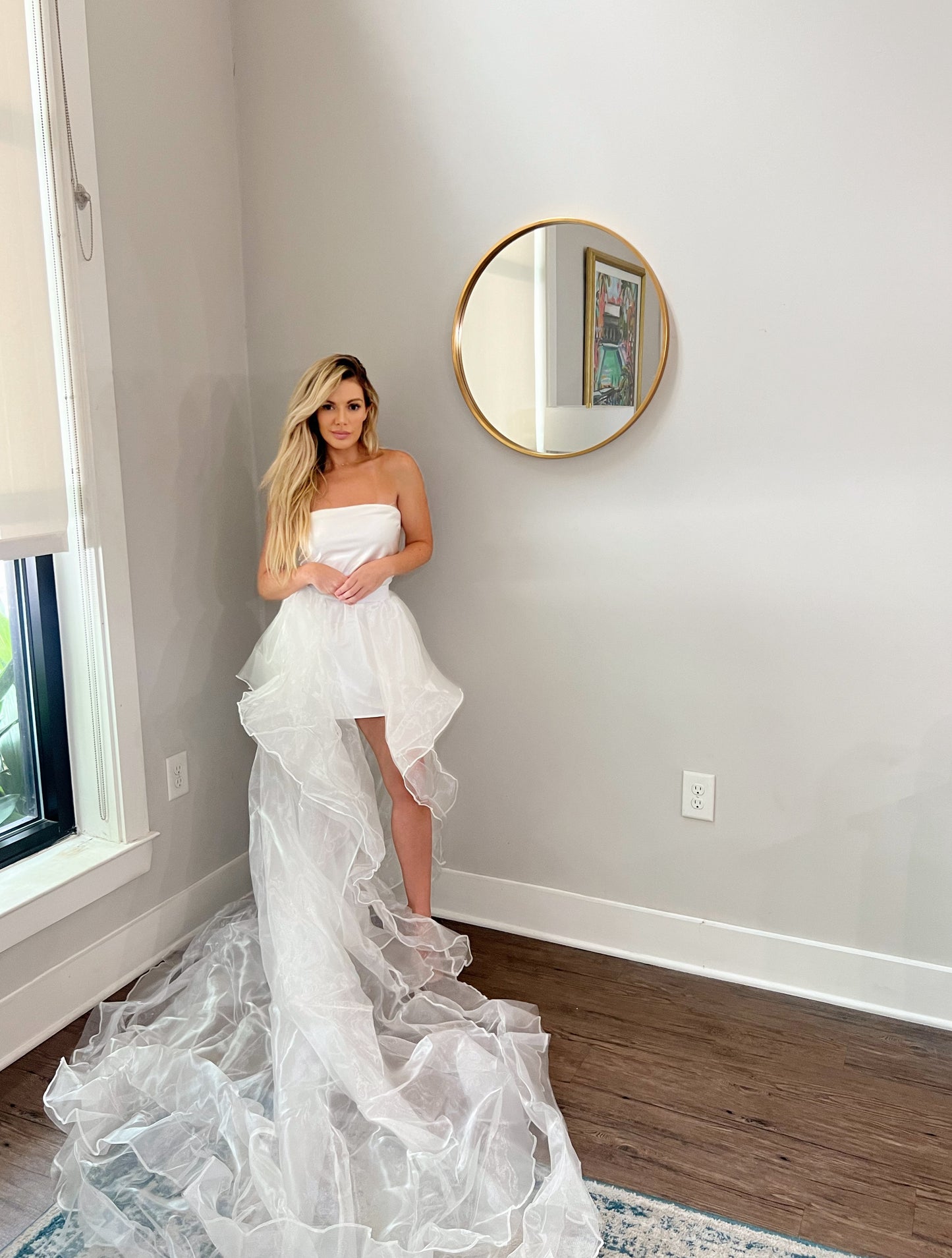 Beautiful waterfall tiered wedding train from tulle fabric. High-low wedding skirt