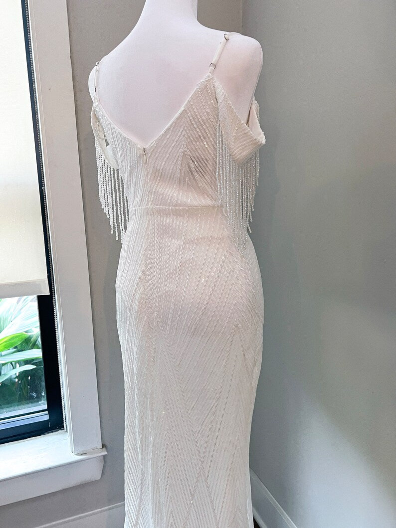 Tear drop sleeves adorned with crystals attached to sleeves wedding dress, rotating 20s wedding gown