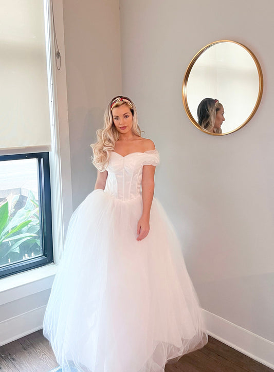 Off Shoulder Neckline Wedding Dress for Romantic Bride. Corset Style Bodice with Visible Bonding for Figure Hugging Wedding Dress