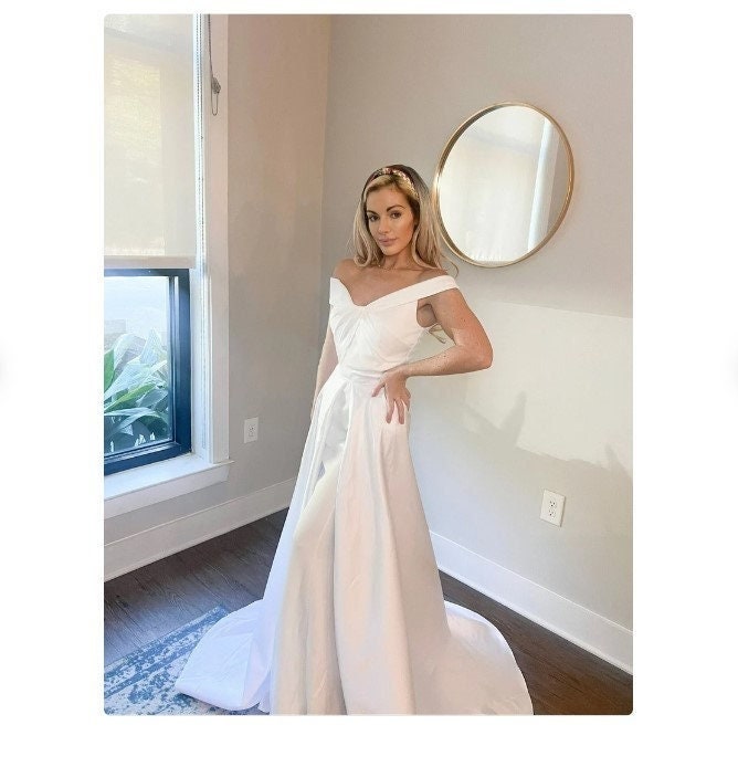 satin trumpet wedding dress Enjoy countless admiring glance when you slip into this enchanting ivory mermaid bridal gown that features a delicate lace Trumpet/Mermaid Cowl Neck Court Train