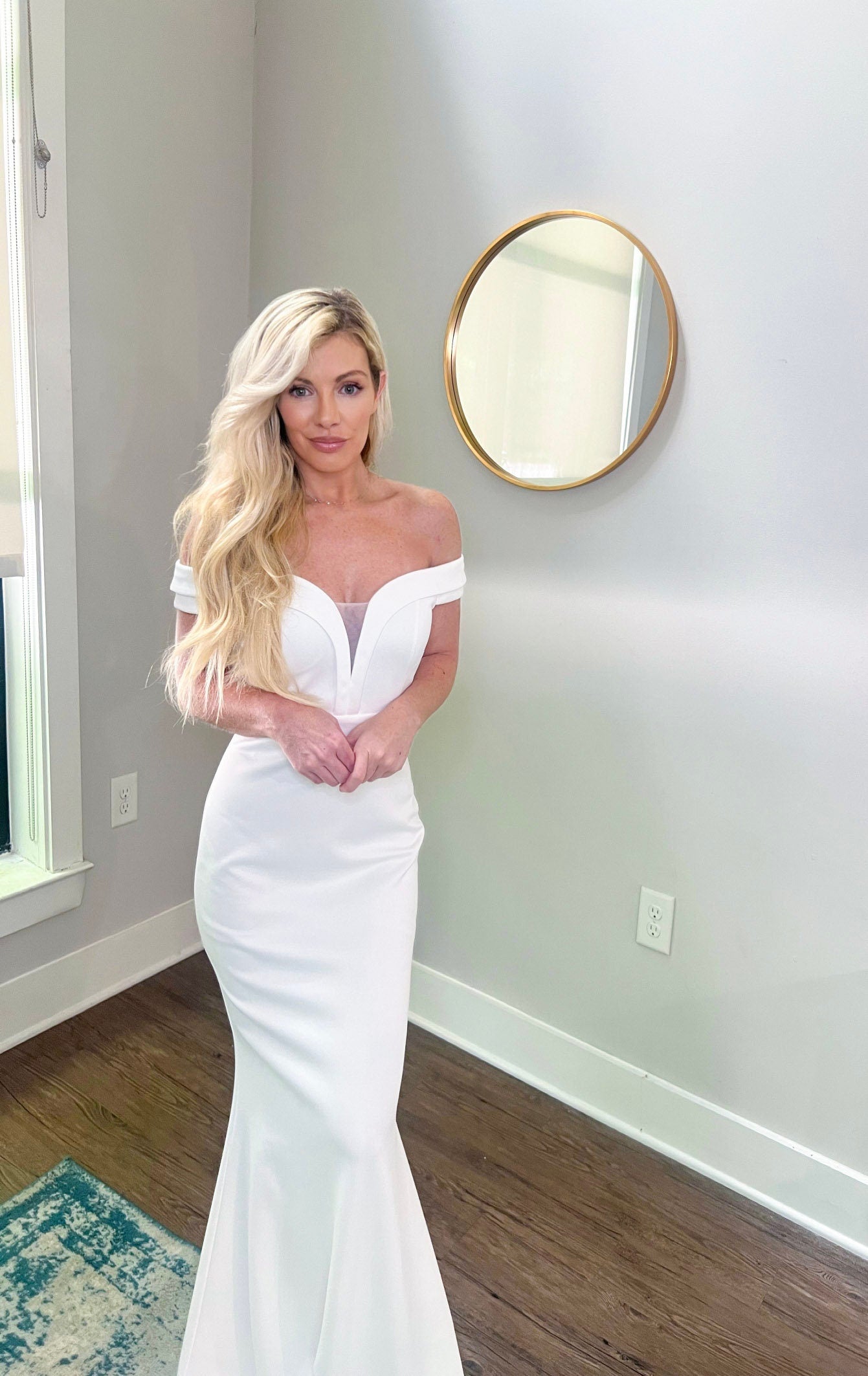 Off the shoulder of bright white wedding gown, fit and flare form fitting wedding gown, simple classic bride affordable wedding dress