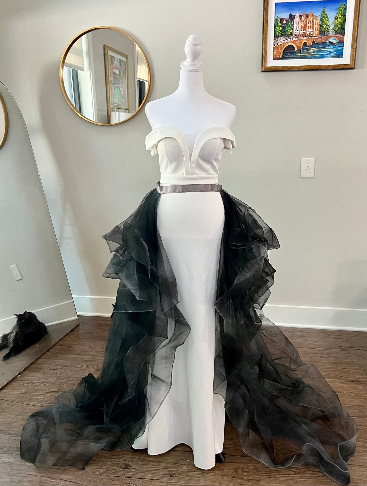 Exquisite black wedding train flowing elegantly behind the bride, embellished with intricate lace and beaded details, perfect for adding a dramatic and sophisticated touch to a gothic or modern wedding.