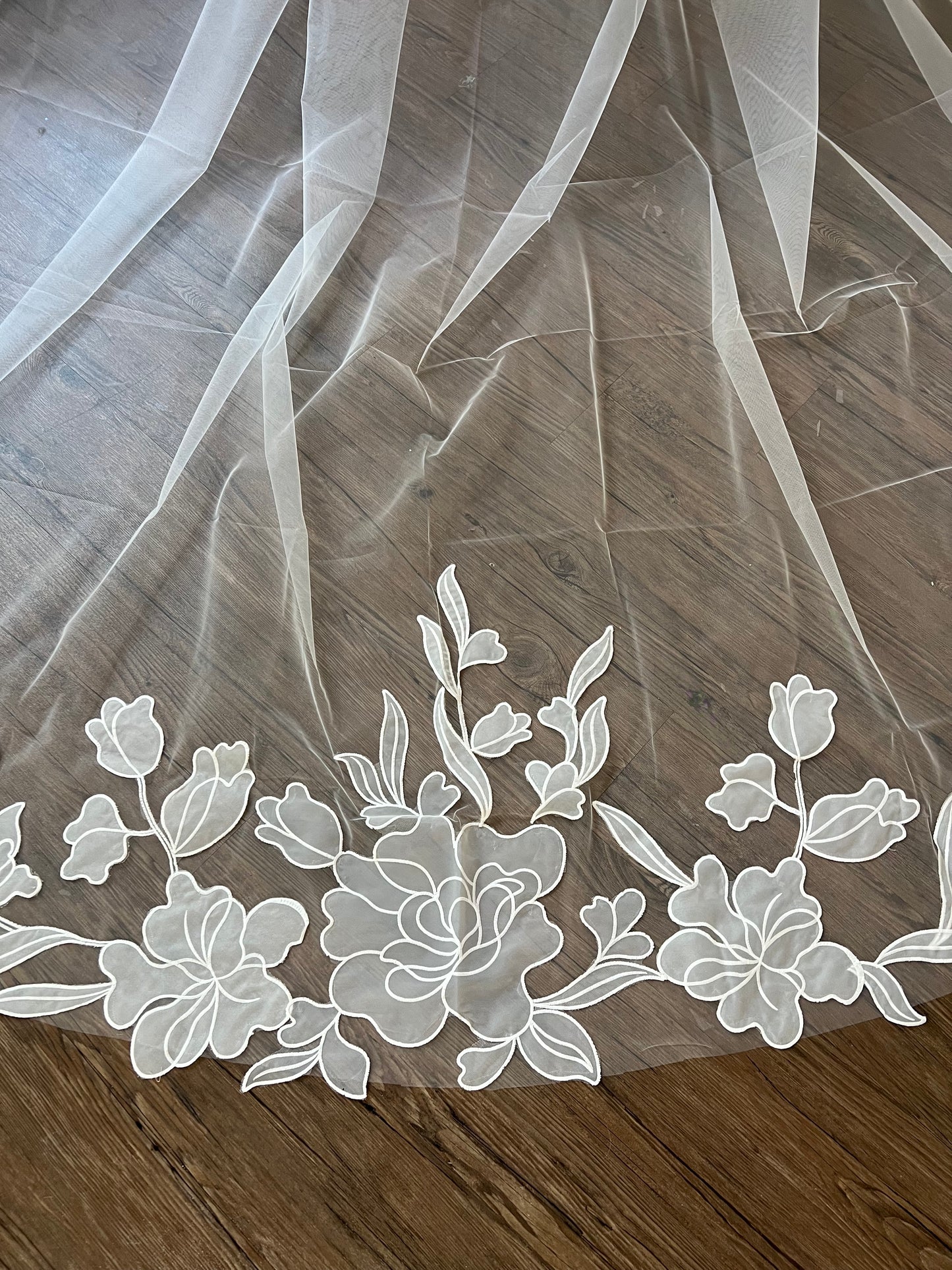 Close up view of wedding veil on hardwood floor